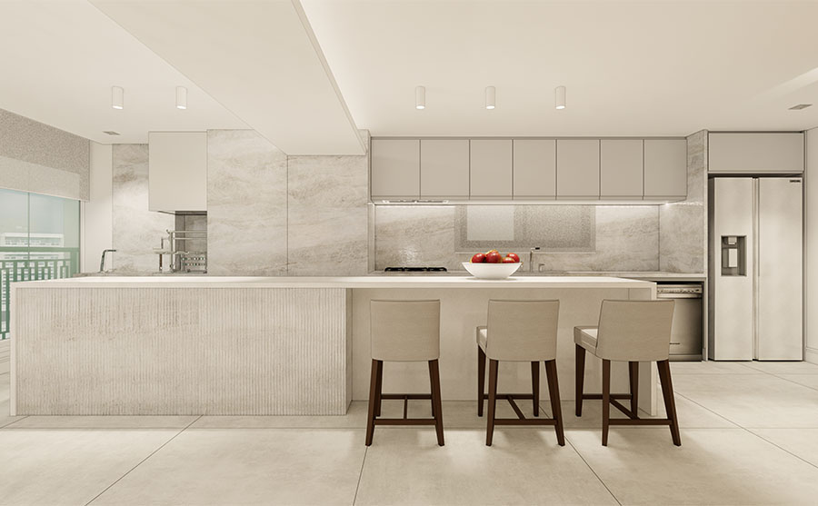 Render 3D da cozinha do One Park Perdizes — cozinha aberta com marcenaria planejada em tons neutros, revestimento travertino em piso e parede, bancada em mármore branco, eletrodomésticos de inox integrados, iluminação superior — projeto Marília Veiga Interiores.